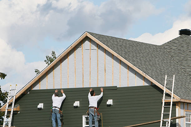 Professional Siding technician working in Troy, OH